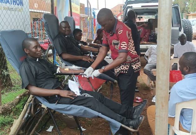 Priests in Hoima Catholic Diocese donate blood during the blood donation exercise in the Hoima communications week activities